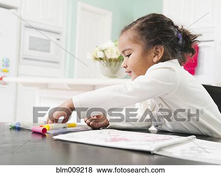Mixed race girl drawing in notebook View Large Photo Image Stock Photo - Mixed race girl drawing in notebook. Fotosearch