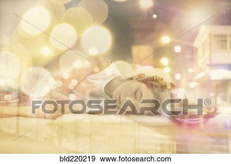 Mixed race girl dreaming of city at night View Large Photo Image Stock Photo - Mixed race girl dreaming of city at night. Fotosearch