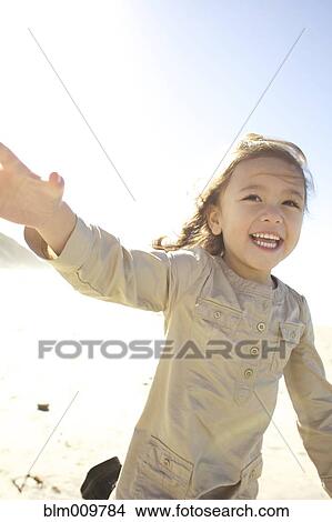 Mixed race girl, running outdoors View Large Photo Image Picture - Mixed race girl, running outdoors. Fotosearch