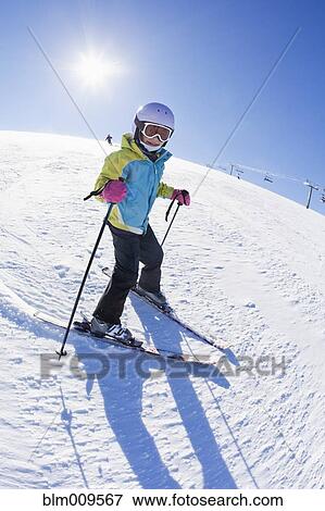 Mixed race girl skiing downhill View Large Photo Image Stock Photo - Mixed race girl skiing downhill. Fotosearch