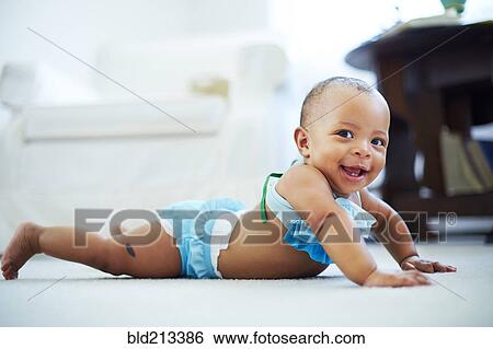 Mixed race girl wearing bikini on living room floor View Large Photo Image Stock Photograph - Mixed race girl wearing bikini on living room floor. Fotosearch