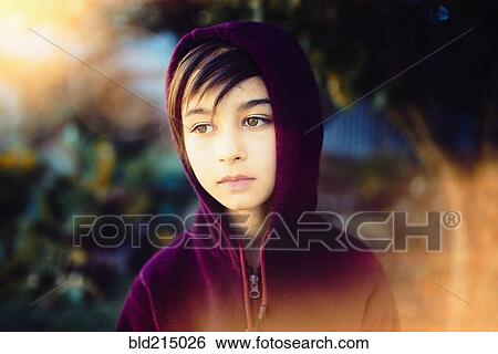 Mixed race girl wearing hoodie outdoors View Large Photo Image Stock Photograph - Mixed race girl wearing hoodie outdoors. Fotosearch