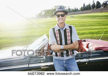 Mixed race man smiling near classic convertible View Large Photo Image Stock Image - Mixed race man smiling near classic convertible. Fotosearch