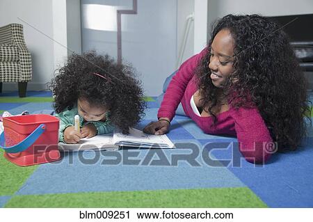 Mixed race mother watching daughter color View Large Photo Image Stock Image - Mixed race mother watching daughter color. Fotosearch