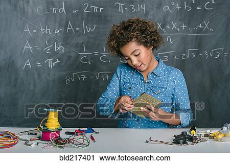Mixed race student building vehicle in science class View Large Photo Image Stock Image - Mixed race student building vehicle in science class. Fotosearch