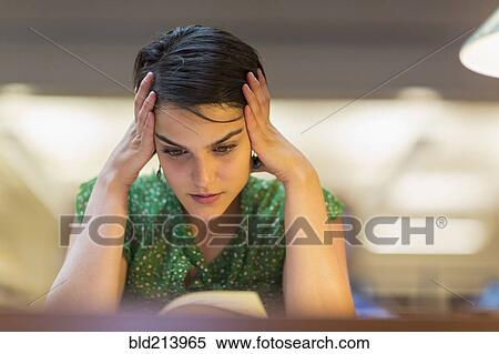 Mixed race student studying in library View Large Photo Image Stock Photography - Mixed race student studying in library. Fotosearch