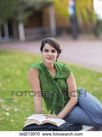 Stock Image - Mixed race student studying on campus. Fotosearch