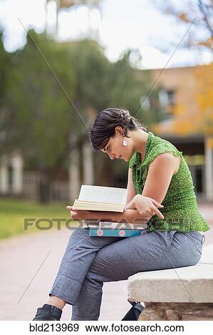 Stock Photo - Mixed race student studying on campus. Fotosearch
