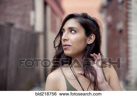 Mixed race woman in city View Large Photo Image Stock Photograph - Mixed race woman in city. Fotosearch