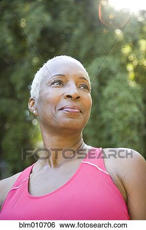 Mixed race woman in sportswear outdoors View Large Photo Image Stock Photograph - Mixed race woman in sportswear outdoors. Fotosearch