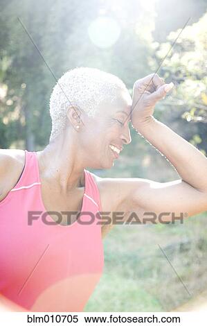Mixed race woman in sportswear outdoors View Large Photo Image Stock Photography - Mixed race woman in sportswear outdoors. Fotosearch