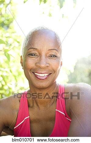 Mixed race woman smiling outdoors View Large Photo Image Stock Image - Mixed race woman smiling outdoors. Fotosearch