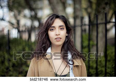 Stock Photograph - Mixed race woman standing outdoors. Fotosearch