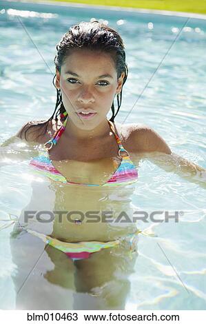 Mixed race woman swimming in swimming pool View Large Photo Image Stock Image - Mixed race woman swimming in swimming pool. Fotosearch