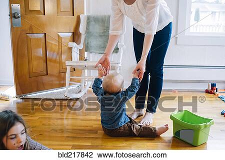 Mother and children playing near doorway View Large Photo Image Stock Image - Mother and children playing near doorway. Fotosearch