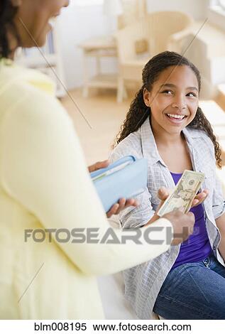 Mother handing money to daughter View Large Photo Image Stock Photography - Mother handing money to daughter. Fotosearch