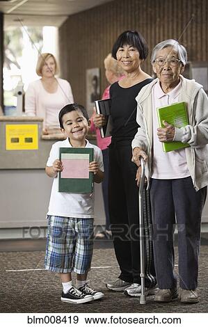 Multi-generational Asian family in library View Large Photo Image Stock Photo - Multi-generational Asian family in library. Fotosearch
