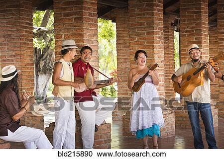 Musicians performing in courtyard View Large Photo Image Stock Image - Musicians performing in courtyard. Fotosearch