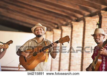 Musicians performing in courtyard View Large Photo Image Stock Image - Musicians performing in courtyard. Fotosearch