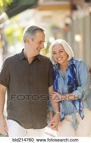 Older Caucasian couple holding hands outdoors View Large Photo Image Stock Image - Older Caucasian couple holding hands outdoors. Fotosearch