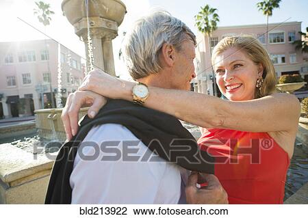 Older Caucasian couple hugging near fountain View Large Photo Image Stock Image - Older Caucasian couple hugging near fountain. Fotosearch