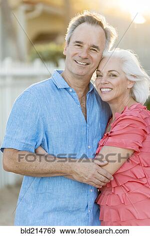 Older Caucasian couple walking on beach View Large Photo Image Stock Photo - Older Caucasian couple walking on beach. Fotosearch