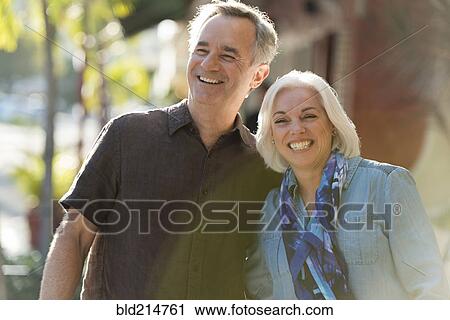 Stock Image - Older Caucasian couple walking outdoors. Fotosearch