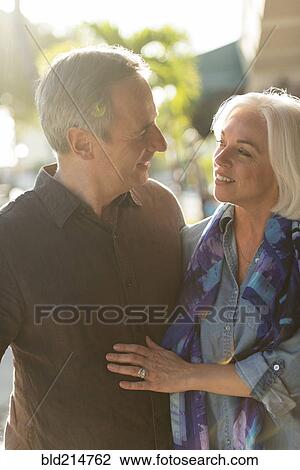 Stock Image - Older Caucasian couple walking outdoors. Fotosearch