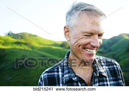 Older Caucasian man smiling on rural hilltop View Large Photo Image Stock Image - Older Caucasian man smiling on rural hilltop. Fotosearch
