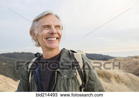 Stock Image - Older Caucasian man standing outdoors. Fotosearch