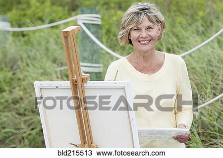 Older Caucasian woman painting outdoors View Large Photo Image Stock Image - Older Caucasian woman painting outdoors. Fotosearch