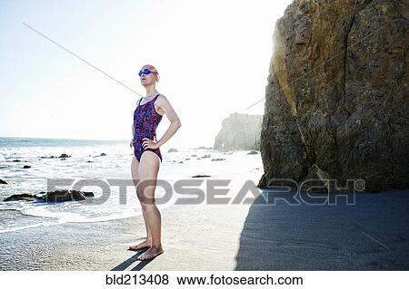 Older Caucasian woman standing on beach View Large Photo Image Stock Photo - Older Caucasian woman standing on beach. Fotosearch
