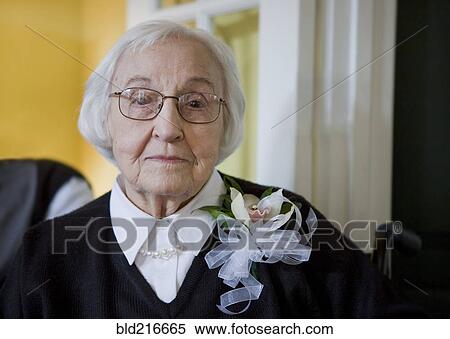 Older Caucasian woman wearing flower corsage View Large Photo Image Stock Photography - Older Caucasian woman wearing flower corsage. Fotosearch