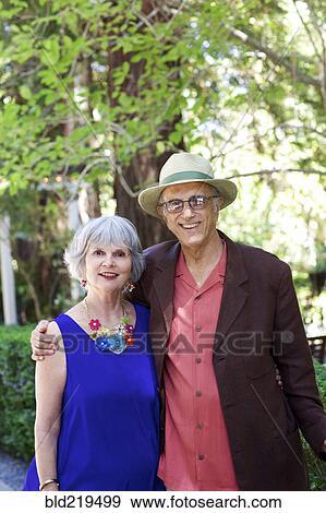Older couple hugging in backyard View Large Photo Image Stock Photo - Older couple hugging in backyard. Fotosearch