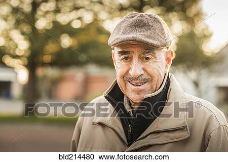 Stock Image - Older Hispanic man smiling outdoors. Fotosearch