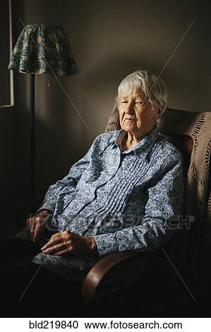 Older mixed race woman sitting in armchair View Large Photo Image Stock Image - Older mixed race woman sitting in armchair. Fotosearch
