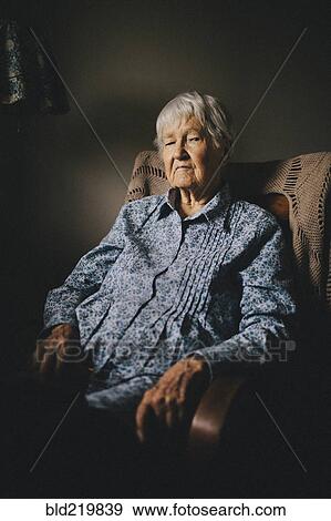 Older mixed race woman sitting in armchair View Large Photo Image Stock Photo - Older mixed race woman sitting in armchair. Fotosearch