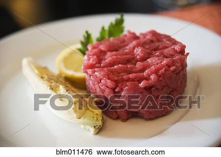 Stock Photograph - Organic, raw, chopped beef. Fotosearch