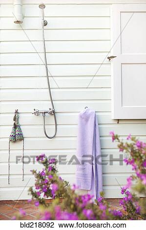 Stock Image - Outdoor shower in backyard. Fotosearch