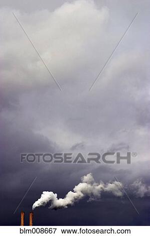 Overcast sky and smoke stacks billowing smoke View Large Photo Image Stock Photo - Overcast sky and smoke stacks billowing smoke. Fotosearch