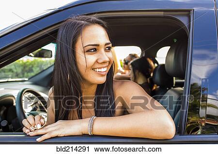 Pacific Islander woman looking out car window View Large Photo Image Stock Image - Pacific Islander woman looking out car window. Fotosearch
