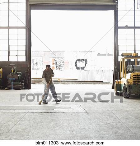 Pacific Islander worker sweeping warehouse View Large Photo Image Stock Image - Pacific Islander worker sweeping warehouse. Fotosearch