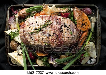 Stock Photo - Pan of meat and vegetables with herbs. Fotosearch