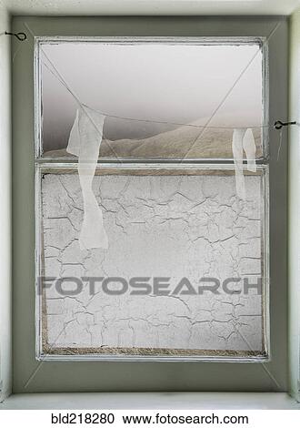 Paper hanging on wire across window View Large Photo Image Stock Image - Paper hanging on wire across window. Fotosearch