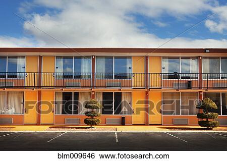 Parking lot, doors and windows of motel View Large Photo Image Stock Photograph - Parking lot, doors and windows of motel. Fotosearch