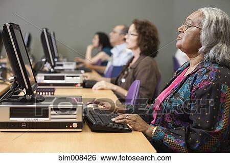 Stock Photograph - People using computers in computer lab. Fotosearch