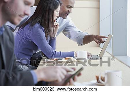 People using electronics in cafe View Large Photo Image Stock Image - People using electronics in cafe. Fotosearch