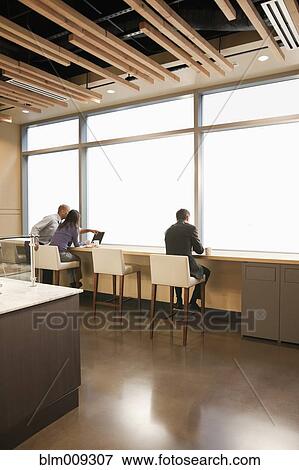 Stock Photo - People working in cafe. Fotosearch