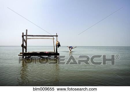 Person jumping from pier into ocean View Large Photo Image Stock Photography - Person jumping from pier into ocean. Fotosearch