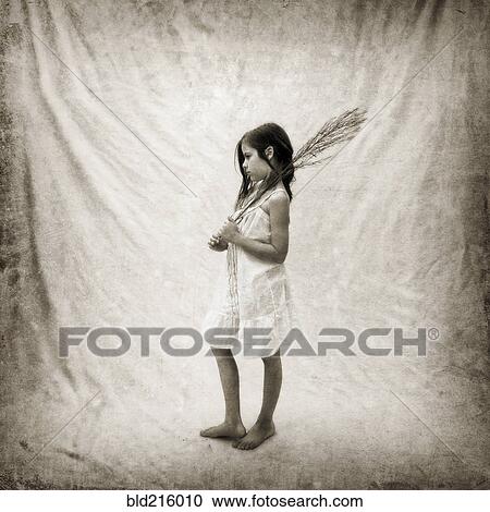 Stock Image - Photograph of girl holding branch on fabric. Fotosearch
